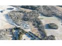 An aerial view of the home on the property showcasing the surrounding trees and landscape at 3374 Skyline Rd, Rock Hill, SC 20730