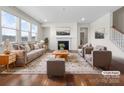 Virtually staged living room with fireplace, neutral decor, and hardwood floors at 368 Pleasant Hill Se Dr, Concord, NC 28025