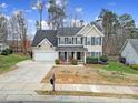 Two-story house with a two-car garage and a landscaped yard at 3812 Leela Palace Way, Fort Mill, SC 29708