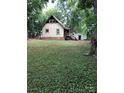 Cabin's backyard with grassy area and shed at 503 Welsh Ave, Monroe, NC 28112