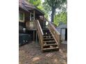 Wooden steps leading up to a cabin's deck at 503 Welsh Ave, Monroe, NC 28112