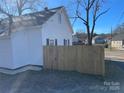 Side view of the house showcasing a wooden fence at 518 W White St, Chester, SC 29706