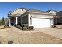 House exterior featuring a two-car garage and well-manicured lawn at 8024 Carolina Lakes Way, Fort Mill, SC 29707