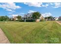 Two-story house with wrap-around porch, stone accents and manicured lawn at 1265 Maddy Ln, Rock Hill, SC 29732