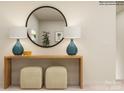 Entryway with console table, mirror, lamps, and two ottomans at 13131 Hampton Bay Ln, Charlotte, NC 28262