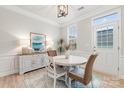 Cozy dining area with white table, wicker chairs, and stylish decor at 135 Singleton Rd, Mooresville, NC 28117
