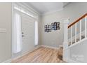 Bright entryway with hardwood floors and staircase at 135 Singleton Rd, Mooresville, NC 28117