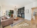 Bright home office with built-in shelving and hardwood floors at 13713 Batemans Rd, Huntersville, NC 28078