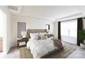 Spacious main bedroom with large windows and plush bedding at 14123 Penbury Ln # 360, Charlotte, NC 28278