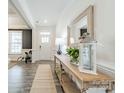 Bright and spacious entryway with a console table and mirror at 172 Longleaf Dr, Mooresville, NC 28117