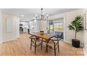 Bright dining area adjacent to the kitchen with hardwood floors and sliding glass doors at 2357 13Th Street Ne Dr, Hickory, NC 28601