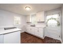 Modern white kitchen with new appliances and dark floors at 2752 21St Ne St, Hickory, NC 28601