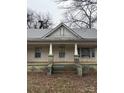 The home features a classic front porch with brick columns at 320 Southern St, East Spencer, NC 28039