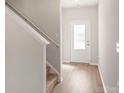 Bright entryway with stairs, light walls, and wood-look floors at 3258 Maple Ridge Dr, Gastonia, NC 28052