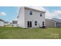 View of the home's backyard featuring a large, well-maintained lawn at 3258 Maple Ridge Dr, Gastonia, NC 28052