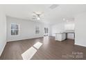 Bright and airy living room featuring lots of natural light and luxury vinyl flooring at 3258 Maple Ridge Dr, Gastonia, NC 28052