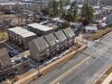 Aerial view of townhouses, modern architecture, and surrounding neighborhood at 3731 S Tryon St, Charlotte, NC 28217