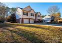 Two-story house with a two-car garage and a large yard at 5241 Whitewater Dr, Hickory, NC 28601