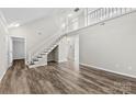 Two-story living room with hardwood floors and loft at 5811 Rocky Mount Ct, Charlotte, NC 28214