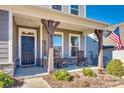 Inviting front porch with rocking chairs and a welcoming sign at 6141 Russo Ct, Lancaster, SC 29720