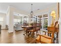 Elegant dining room with hardwood floors and view to the back porch at 6248 Raven Rock Dr, Denver, NC 28037