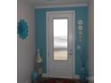 Bright entryway with teal accent wall and decorative accents at 106 Milliner Dr # 97, Troutman, NC 28166