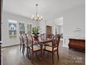 Spacious dining room with ample natural light, featuring dark hardwood floors and detailed trim at 120 Trelawn St, Fort Mill, SC 29715