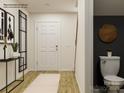 Small bathroom with pedestal sink, dark gray walls, and wood-look circular accent at 13124 Hampton Bay Ln, Charlotte, NC 28262