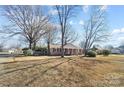 Ranch house with a large front yard and mature trees at 2203 O'Hara Dr, Charlotte, NC 28273