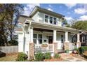 Light-colored home with a large porch and brick accents at 2358 Morton St, Charlotte, NC 28208