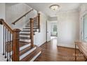 Bright entryway with a staircase, hardwood floors and access to other rooms at 2625 Croydon Rd, Charlotte, NC 28209