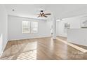 Bright living room with hardwood floors, neutral walls, and plenty of natural light at 3220 Capitol Dr, Charlotte, NC 28208