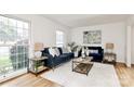 Inviting living room with hardwood floors, bright windows, and stylish decor at 3828 Chandworth Rd, Charlotte, NC 28210