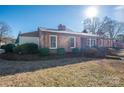 Brick ranch house with mature landscaping at 401 Kenwood Ave, Cherryville, NC 28021