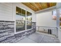 Front porch with stonework, railing, and a window seat at 5036 Heathland Dr # 71, Charlotte, NC 28215