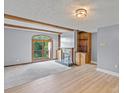 Bright living room featuring hardwood floors, fireplace, and sliding glass doors at 5190 Corbin Ln, Hickory, NC 28601