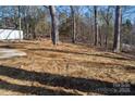 Partially cleared side yard with straw ground cover at 5966 Quarter Mile Rd # 2, Clover, SC 29710