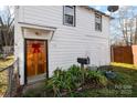 White house with wooden door and plants at 714, 716 Lucas St # 2A, Rock Hill, SC 29730