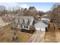 Aerial view showing a two-story house, driveway, and backyard at 841 Deerfield Dr, Mount Holly, NC 28120