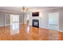 Spacious living room with hardwood floors, fireplace and lots of natural light at 8622 Lower Rocky River Rd, Concord, NC 28025