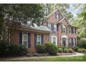 Brick house with black shutters and manicured landscaping at 8804 Ferngrove Ct, Waxhaw, NC 28173