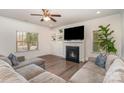 The home's living room with a fireplace and a TV and large sectional sofa at 9230 Windygap Rd, Charlotte, NC 28278