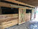 rustic barn with two wooden stalls, ideal for horses or other animals at 1262 Ring Tail Rd, Claremont, NC 28610