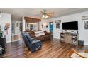 Living room with brown sofa, recliner, and hardwood floors at 127 Halifax Ct, Gastonia, NC 28056