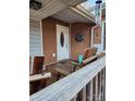 Charming front porch with a wooden bench and wreath near the entry door at 1721 Gold Hill Rd, Concord, NC 28025