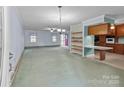 Open living room and kitchen area with plenty of natural light at 1721 Gold Hill Rd, Concord, NC 28025