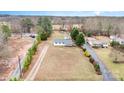 Aerial view of the home featuring a metal roof and a spacious yard at 1876 Rollins Dr, Catawba, NC 28609