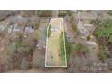 Aerial view of property including house, outbuilding and defined property lines at 1876 Rollins Dr, Catawba, NC 28609