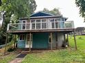 Charming lake house with a large deck and abundant natural light from many windows at 198 Clouse Ln, Taylorsville, NC 28681