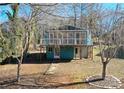 Two-story lake house featuring a full-length deck providing ample outdoor space at 198 Clouse Ln, Taylorsville, NC 28681